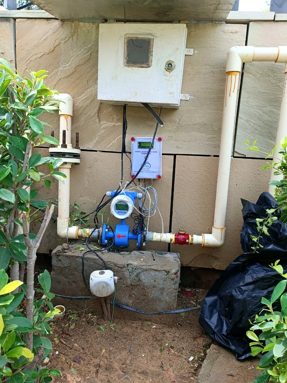 Electromagnetic flow meter with SenseIndia telemetry system installed on water pipeline